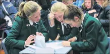  ??  ?? Sussing it out . . . Craighead Diocesan School pupils (from left) Alysha Bradley, Jahzara Payne and Jessamy Roadley (all 12) support each other during the year 78 quiz in Timaru last night.