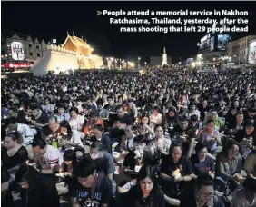  ??  ?? > People attend a memorial service in Nakhon Ratchasima, Thailand, yesterday, after the mass shooting that left 29 people dead