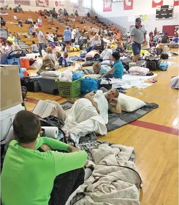 ??  ?? People take shelter at Key West High School in Key West, Florida, as Hurricane Irma approaches. — Reuters photo
