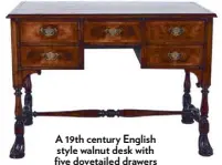  ??  ?? A 19th century English style walnut desk with five dovetailed drawers