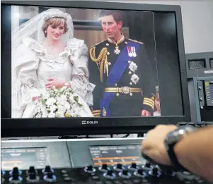  ?? AP PHOTO ?? A 35mm film of the wedding of Britain’s Prince Charles and Lady Diana Spencer is colour graded by Gerry Gedge after it has been digitised, at R3store lab in London, Friday, Aug. 18, 2017. Thirty-six years after Lady Diana Spencer married Prince...