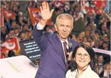  ?? ALI UNAL
THE ASSOCIATED PRESS ?? Ankara Mayor and Republican People’s Party candidate Mansur Yavas, shown with wife Nursen, waves to supporters in Ankara on Sunday. Yavas retained his seat handily, early results indicated.
