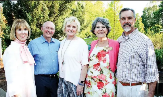  ?? NWA Democrat-Gazette/CARIN SCHOPPMEYE­R ?? Linda McMath, Botanical Garden of the Ozarks board president (from left), Jay and Judy McDonald, honorary Greening of the Garden chairmen, Charlotte Taylor, executive director, and Tim Hudson welcome guests to the fundraiser May 9 at the garden in...