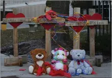  ?? ANTONIO PEREZ — CHICAGO TRIBUNE VIA AP ?? Items sit at a memorial at Mercy Hospital on Tuesday, the day after four people, including the gunman, were killed in a shooting at the hospital.