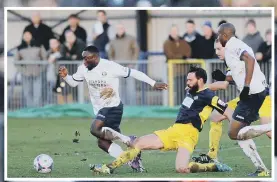  ??  ?? DERBY ACTION Sahr Kabba, left, tackled by Gosport’s Jamie Brown