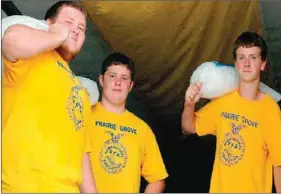  ??  ?? One of the projects for Prairie Grove’s FFA Club is to deliver ice to vendors during the annual Clotheslin­e Fair at Prairie Grove Battlefiel­d State Park. FFA members Dakota Davis, Jacob Ward and David Smith take their turn to carry ice to the...