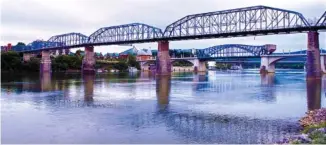  ?? STAFF PHOTO BY MARK PACE ?? The Tennessee River flows through Chattanoog­a on Thursday. About 500 swimmers will compete this weekend in the Chattanoog­a Swim Fest, which will end downstream from the Market Street Bridge.