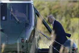  ?? PATRICK SEMANSKY — THE ASSOCIATED PRESS ?? President Joe Biden boards Marine One at Cape Henlopen State Park in Rehoboth Beach, Del., on Sunday after spending the weekend at his home.