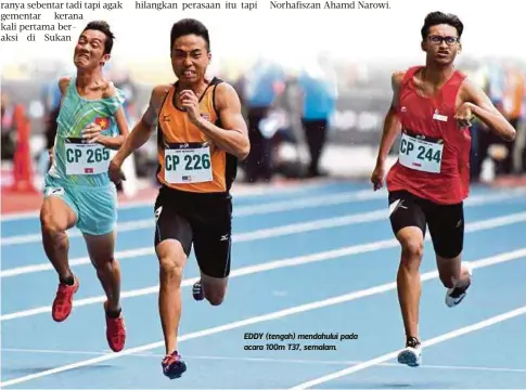  ??  ?? EDDY (tengah) mendahului pada acara 100m T37, semalam.