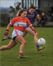  ??  ?? Ceire Nolan of Louth strides forward.