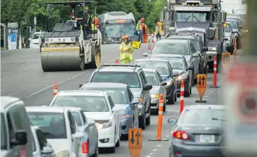  ?? ARLEN REDEKOP/PNG FILES ?? Warm weather also brings on a greater number of road constructi­on projects across the province, each of which involve inherent safety risks — for drivers, cyclists and road constructi­on crew members.