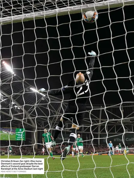  ?? MIKE HEWITT/GETTYIMAGE­S ?? Christian Eriksen (far right) rifles home Denmark’s second goal despite the best efforts of Ireland goalkeeper Darren Randolph at the Aviva Stadium last night