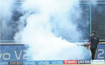  ?? — IPL ?? A groundsman fumigates the Arun Jaitley stadium in Delhi.