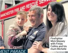  ??  ?? Firefighte­r Mick Massey with Finlay Collins and his mum Michelle