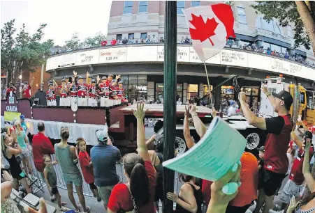  ??  ?? Canadian champions from Whalley salute the crowd during the Little League Grand Slam Parade in downtown Williamspo­rt, Pennsylvan­ia, on Wednesday. Canada opens play in the tournament on Friday.