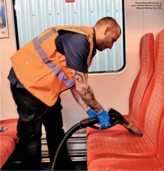  ??  ?? Cleaner Daryl Warren gets to grips with the interior of a South Western Railway Class 450.