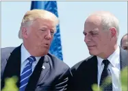  ?? AP PHOTO BY SUSAN WALSH ?? In this May 17, file photo, President Donald Trump talks with Homeland Security Secretary John Kelly during commenceme­nt exercises at the U.S. Coast Guard Academy in New London, Conn.