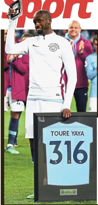  ?? — AFP / Reuters ?? Swan song: Manchester City’s Yaya Toure posing with an award after playing his last game for the club in the English Premier League match against Brighton at the Etihad on Wednesday. Right: City manager Pep Guardiola applauding.