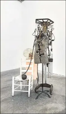 ?? CONTRIBUTE­D BY FREDRIK BRAUER ?? “Permanent: Hair Was My Glory and Chain” (2016) is by Lonnie Holley. Hair dryer, found chair, ball and chain, lock and key, dress form, permanent wave machine.