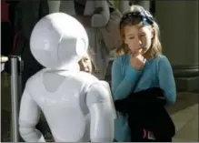  ?? JEFF CHIU — THE ASSOCIATED PRESS ?? Emerson Hill, 6, plays with Pepper the robot at Westfield Mall in San Francisco.