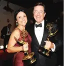  ?? FRANK MICELOTTA/INVISION/AP ?? Julia Louis-Dreyfus and Stephen Colbert celebrate their wins at the 2012 Emmys.