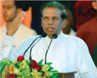  ??  ?? In this file photo, Sri Lanka’s President Maithripal­a Sirisena gestures as he addresses supporters at a rally in Colombo.