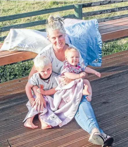  ??  ?? A cut above: Former hairdresse­r Monique Neeson, with son Heath and daughter Effie. Monique now makes specialist all-wool blankets made from wool grown in the King Country.