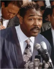  ?? DAVID CRANE – SOUTHERN CALIFORNIA NEWS GROUP ?? Rodney King calls for an end to the violence May 1, 1992: “People, I just want to say, you know, can we all get along?” King, who struggled with substance abuse, died at 47 on June 17, 2012. He was found in his swimming pool. The autopsy showed that an “alcohol and druginduce­d delirium” led to his drowning. His death was ruled
both accidental and self-inflicted