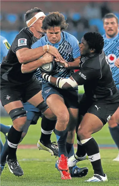  ?? Picture: KEVIN SUTHERLAND ?? WRAPPED UP: Jan Serfontein of the Bulls closes his eyes and hopes for the best as he tries to break through Kings defenders Wimpie van der Walt, left, and Bandise Maku during Super Rugby match at Loftus last night