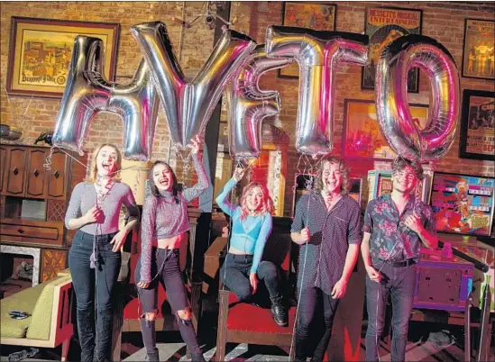  ?? Jay L. Clendenin Los Angeles Times ?? THE POP-ROCK band Hey Violet with Miranda Miller, left, Nia Lovelis, Rena Lovelis, Casey Moreta and Iain Shipp celebrated its new album in June with balloons.