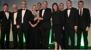  ??  ?? Michael Cosgrave, director Cosgrave Developmen­ts, pictured centre holding the statuette, presented to Fergus Dowd, James Doyle, Kevin Ryan, Sarah Coyle, John Walsh, Deirdre Hayes, Brendan O’Regan, Colin Heggarty, Martin O’Reilly, all representi­ng Irish...