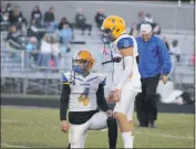  ?? STAFF PHOTO BY JOHN NISWANDER ?? Cougars quarterbac­k Cole Lucia and kicker Nicco Vargas warm up field goal attempts prior to their game at La Plata on Friday. Vargas would connect on two field goals in Thomas Stone’s 26-20 victory.