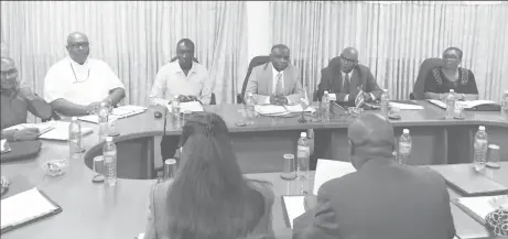  ??  ?? Minister of Foreign Affairs Carl Greenidge (third from right) along with Head of the Surinamese Delegation John Kolalder (second from right) with members of the commission.