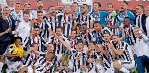  ?? AP ?? Juventus players celebrate with the trophy at the end of the Italian Cup final match. —
