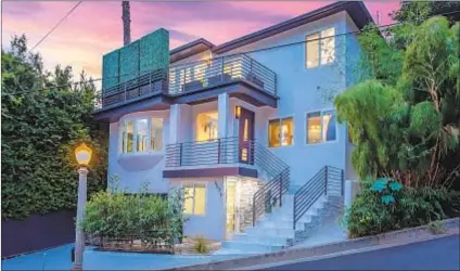  ??  ?? SET ABOVE the Sunset Strip and listed at $2.499 million, the home spans 2,487 square feet.