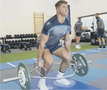  ?? PICTURES: BILL MURRAY/ SNS GROUP/SRU ?? 2 Scotland centre Huw Jones is put through his paces before hitting the weights, above, during a fitness session for Gregor Townsend’s squad at Oriam on Monday. 3 Jones dives over the tryline for his second score in Scotland’s memorable Calcutta Cup win over England at BT Murrayfiel­d in February 2018.