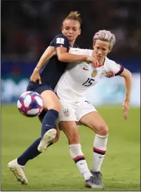  ?? ALEX GRIMM/GETTY IMAGES/TNS ?? Marion Torrent of France battles for possession with USA's Megan Rapinoe during Friday's quarterfin­al match at Parc des Princes in Paris, France.