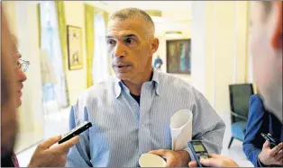  ?? AP PHOTO ?? Former New York Yankees manager Joe Girardi talks with reporters at the annual MLB general managers’ meetings in Orlando, Fla., on Tuesday.