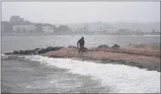  ?? Brian A. Pounds / Hearst Connecticu­t Media ?? Heavy rains and surf from the remnants of Tropical Storm Henri at Gulf Beach in Milford on Monday, Aug. 23.