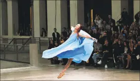  ?? Francois Mori / Associated Press ?? A model wears a creation as part of the Issey Miyake Ready To Wear SpringSumm­er 2020 collection Friday, unveiled during fashion week in Paris.