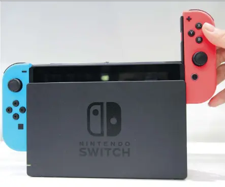  ?? KOJI SASAHARA/THE ASSOCIATED PRESS ?? Nintendo claims its new Switch console will finally bridge the gap between home and portable gaming.