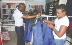  ??  ?? Fashion enthusiast­s select outfits at some boutiques in Harare