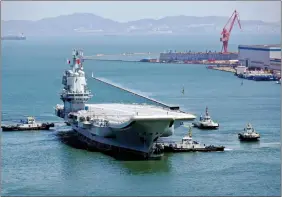  ?? REUTERS ?? China’s first domestical­ly developed aircraft carrier is seen at a port in Dalian after completing its first sea trials, in Liaoning province, China, on Friday.