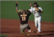  ?? JOSE CARLOS FAJARDO — BAY AREA NEWS GROUP ?? The Giants’ Brandon Crawford (35) forces out the Padres’ Manny Machado at second base and throws to first for the double play in the third inning in San Francisco last September.