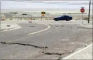  ?? AP PHOTO/MARCIO JOSE SANCHEZ ?? An earthquake-damaged street is seen Saturday in Trona, Calif.