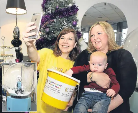  ??  ?? WESTPORT Apartments in Dundee has started a selfie competitio­n, with Oor Snowglobe as star of the show.
The company, owned by Sarah Rennie, sponsored Thick Cuts Oor Wullie for the Bucket Trail and is now raising additional funds for the Archie...