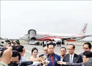  ?? SUPPLIED ?? A senior official speaks to the media after the first of Chinese-owned Ruili Airlines’ resumed regular flights to Sihanoukvi­lle touched down on January 27, with a total of 104 passengers aboard.