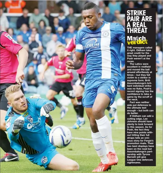  ?? PICTURES: Joe Dent ?? FOUL! Peterborou­gh’s Britt Assombalon­ga is brought down by Oldham’s Mark Oxley for a penalty