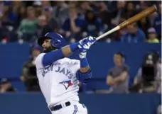  ?? THE CANADIAN PRESS ?? Jays right fielder Jose Bautista hit his second homer Wednesday, as did Dalton Pompey and Devon Travis.