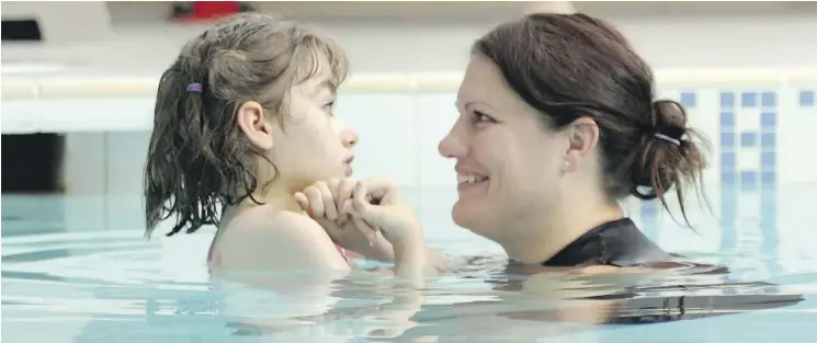  ??  PHOTOS: CHRISTINA RYAN ?? Twelve-year-old Emma Francis, who suffers from Rett Syndrome, enjoys a “chance to dance” in the pool with her Watsu therapist Tanya Salwach.